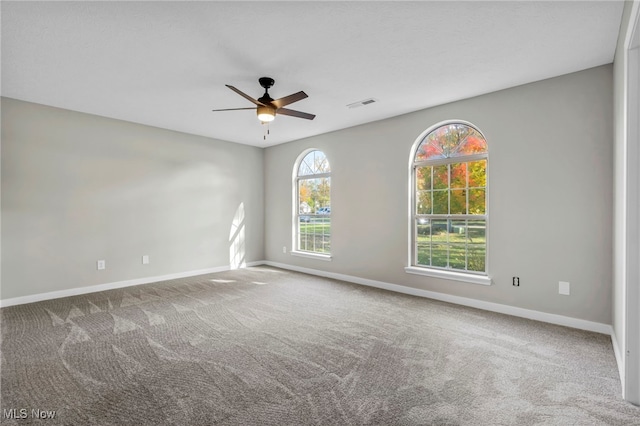 carpeted empty room with ceiling fan