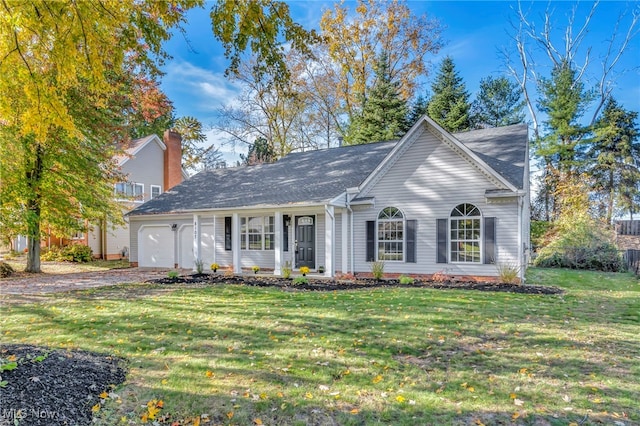 view of front of house with a garage and a front yard