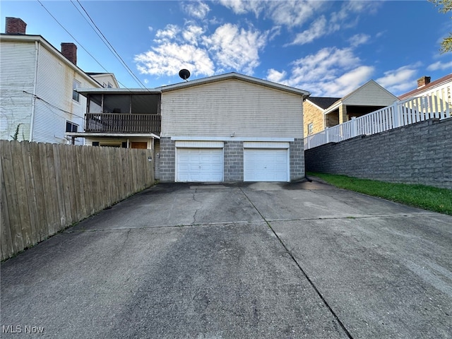 view of side of home featuring a garage