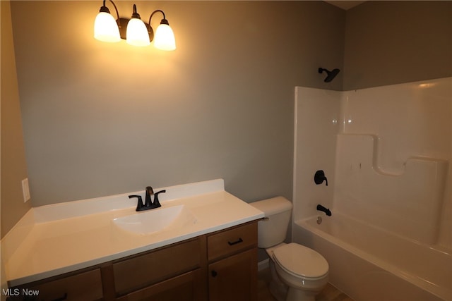 full bathroom featuring vanity, toilet, and washtub / shower combination