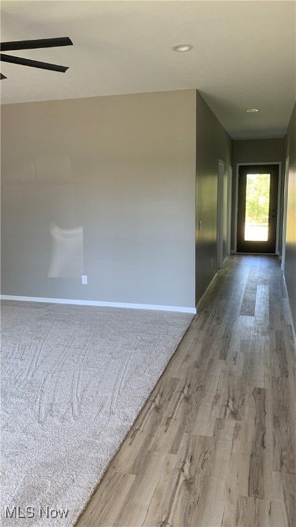 hallway featuring hardwood / wood-style flooring