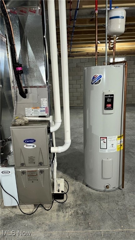 utility room with electric water heater and heating unit