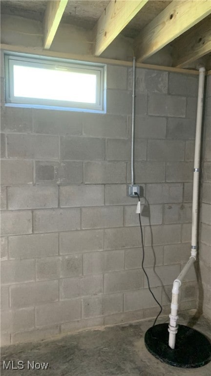 bathroom with beam ceiling and plenty of natural light