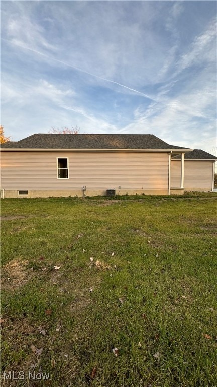 view of home's exterior with a yard