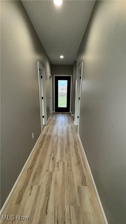 corridor featuring light wood-type flooring