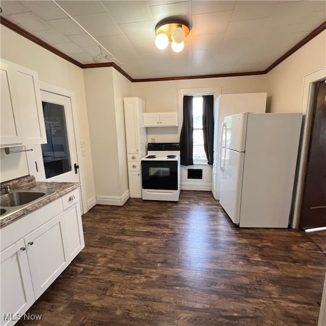 kitchen with sink, white cabinets, dark wood-type flooring, and white appliances