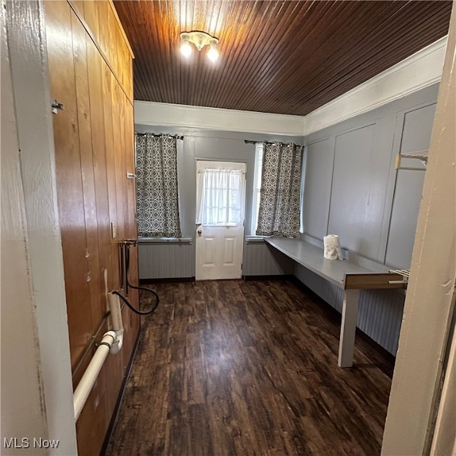 interior space with radiator heating unit, wooden ceiling, and dark hardwood / wood-style flooring