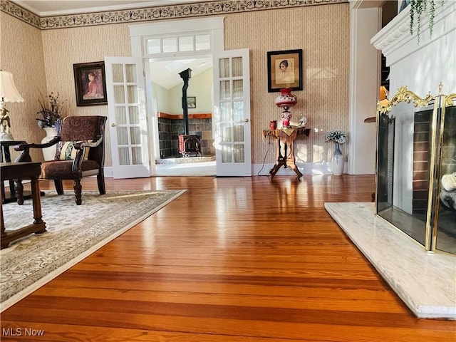 sitting room with wood-type flooring and french doors