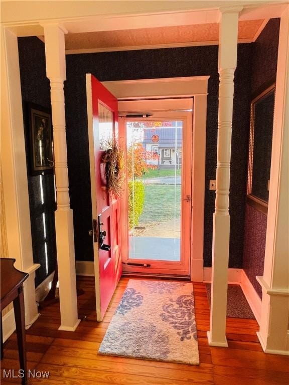 doorway to outside with wood-type flooring