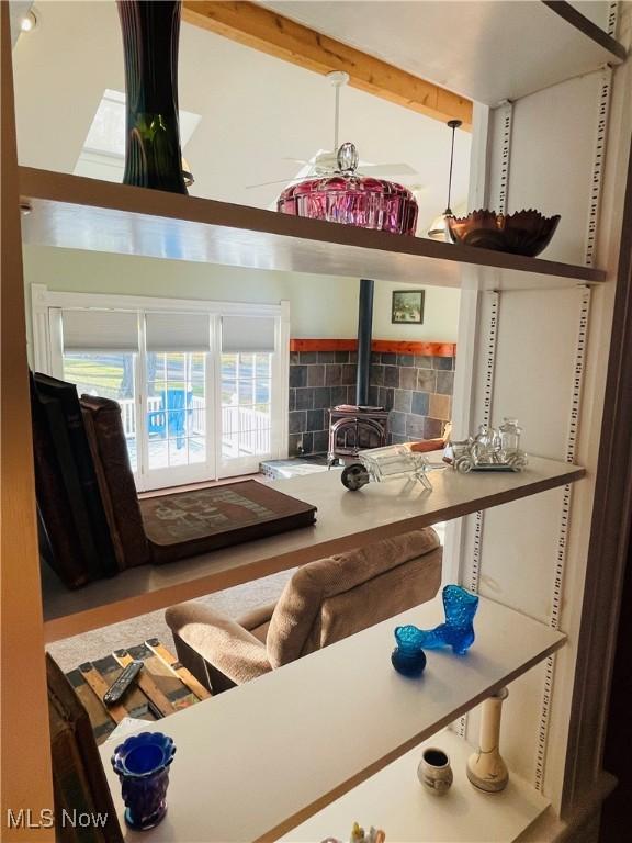 room details featuring a wood stove and tasteful backsplash