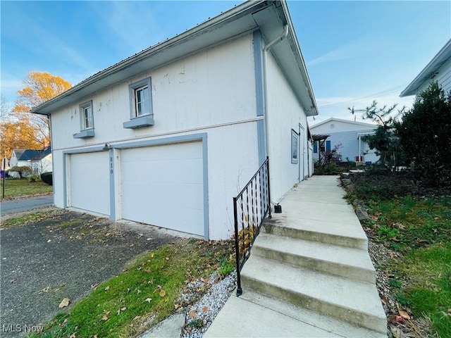 view of side of property featuring a garage