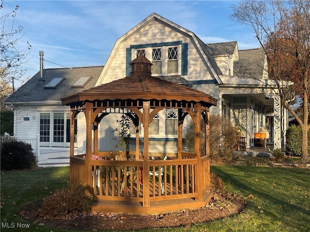 exterior space featuring a gazebo and a lawn