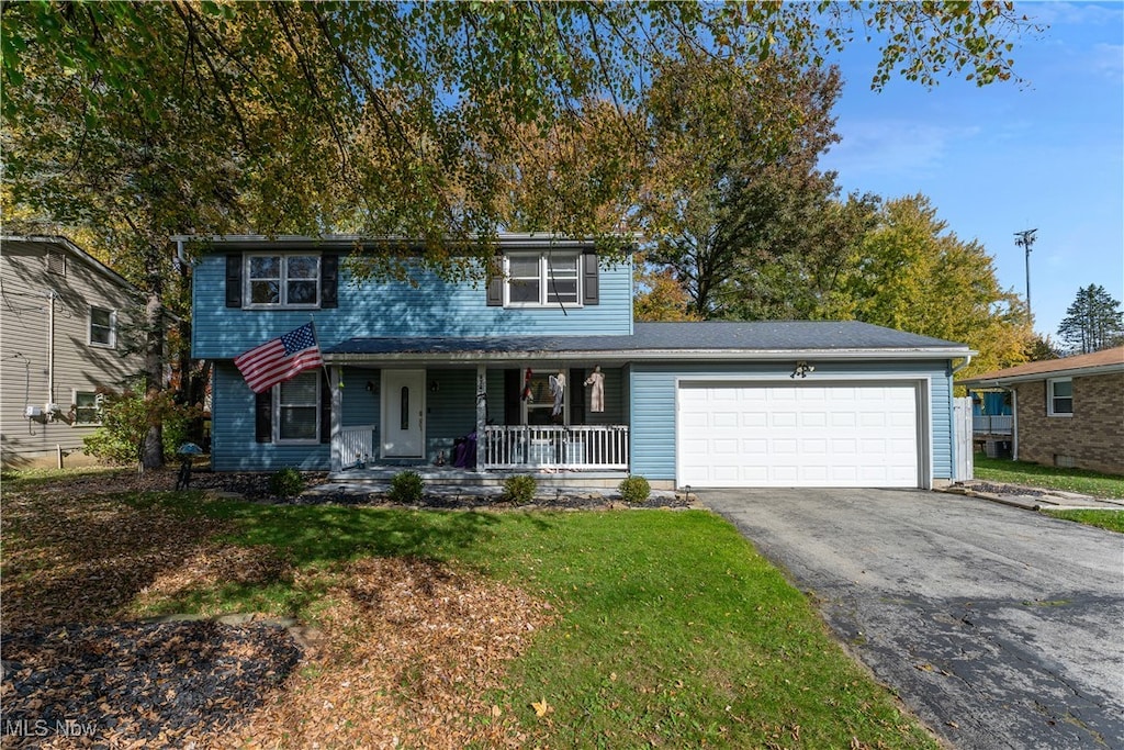 view of front of house with covered porch and a garage