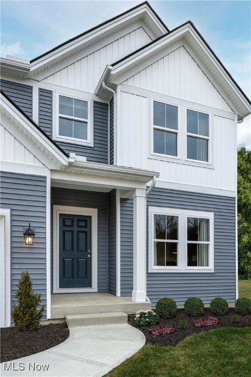 view of exterior entry with a porch