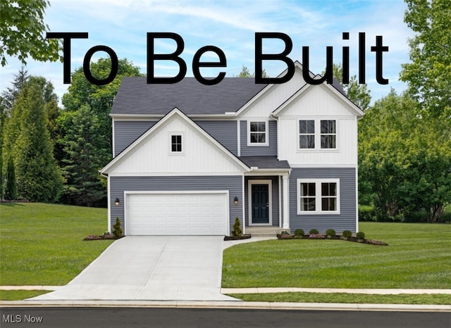 view of front of home with a front yard and a garage