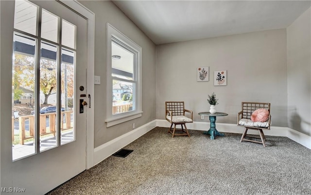 3219 11th St SW, Canton, OH 44710 - living area featuring dark carpet and visible vents