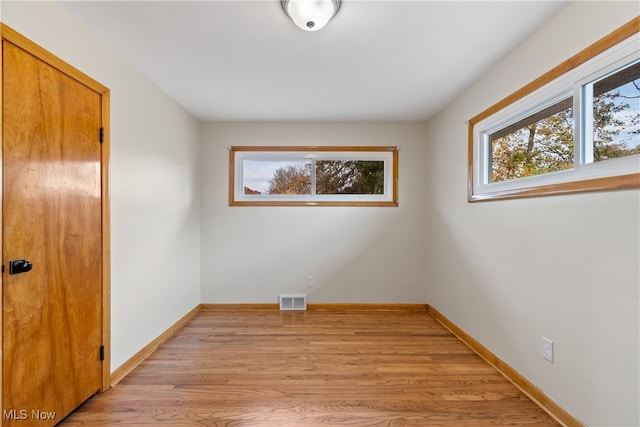 unfurnished room featuring light wood-type flooring