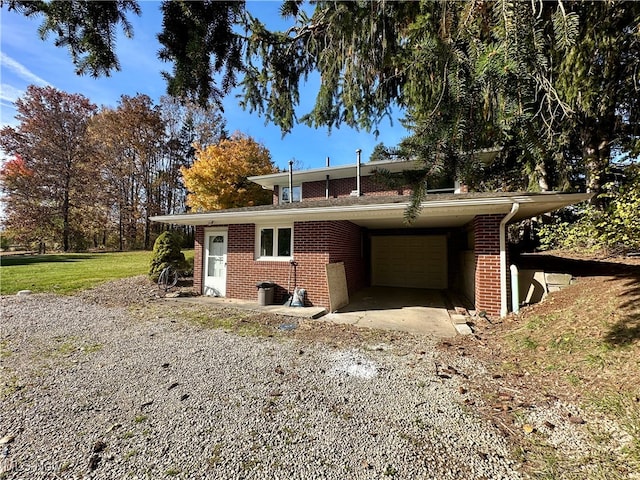 exterior space featuring a front yard and a carport