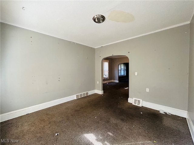 carpeted empty room featuring ornamental molding