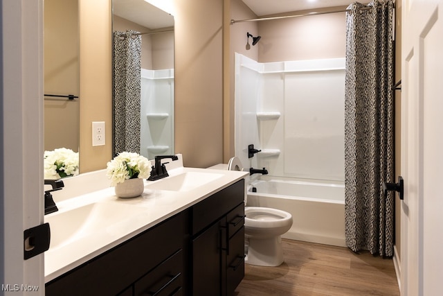 full bathroom with vanity, toilet, shower / bathtub combination with curtain, and hardwood / wood-style floors