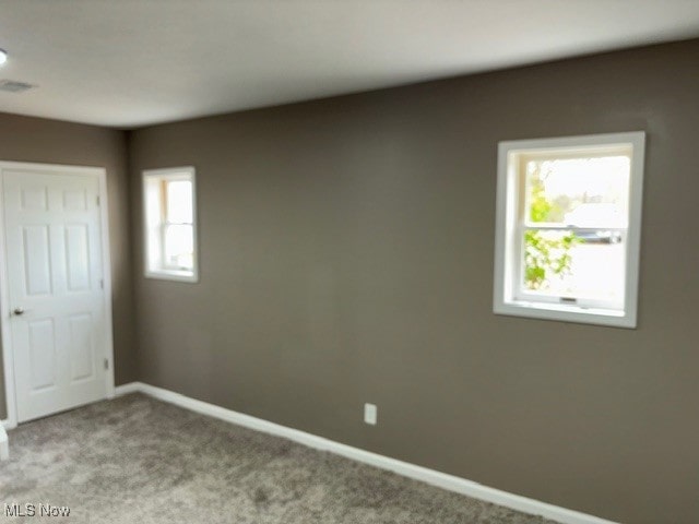 empty room with light colored carpet