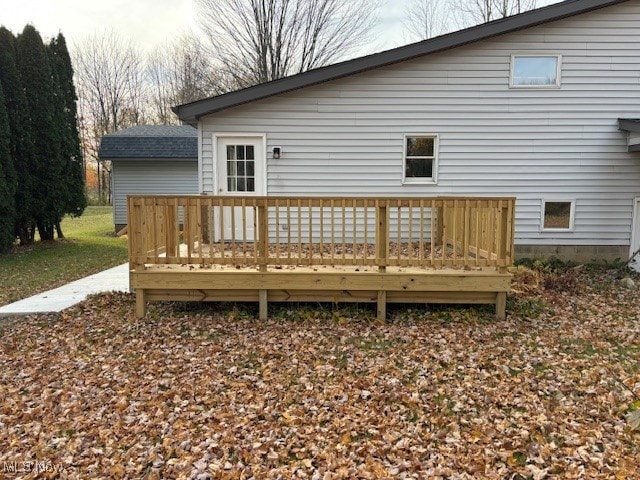 back of property featuring a deck