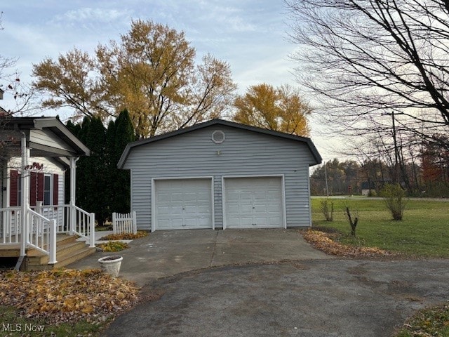 garage featuring a yard