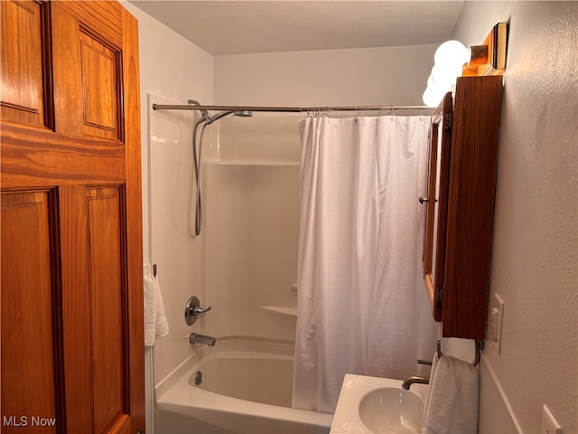 bathroom with vanity and shower / tub combo with curtain