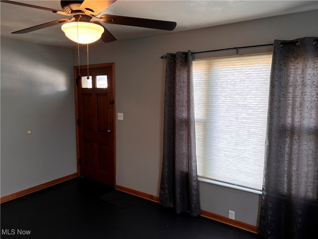 foyer featuring ceiling fan and a wealth of natural light