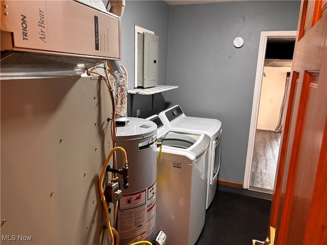 laundry area with electric panel, separate washer and dryer, and gas water heater