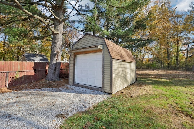 garage featuring a yard