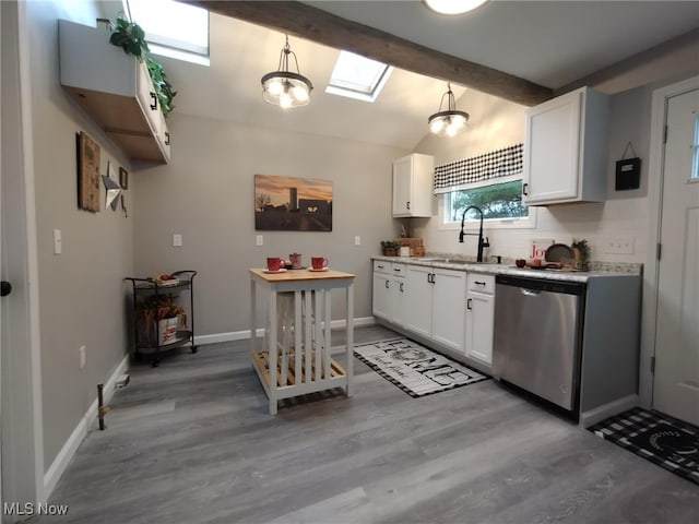 kitchen with white cabinetry, hanging light fixtures, stainless steel dishwasher, and sink