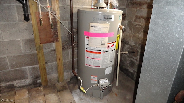 utility room featuring gas water heater