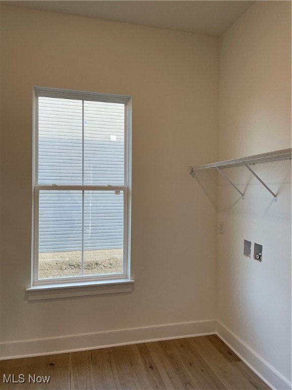 laundry area with hookup for a washing machine and wood-type flooring