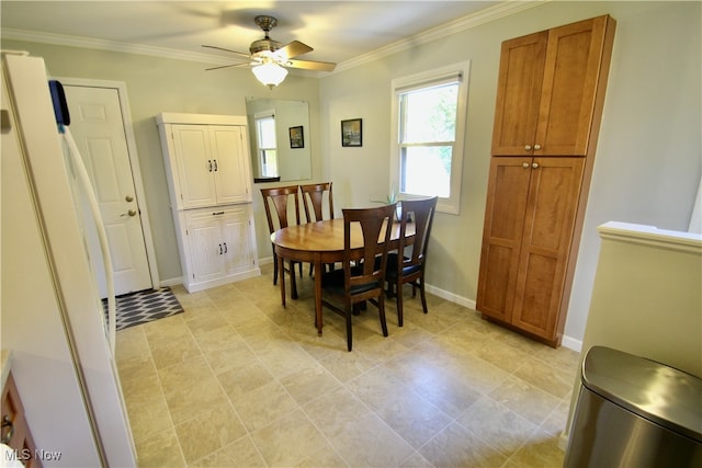 dining space featuring ceiling fan and ornamental molding