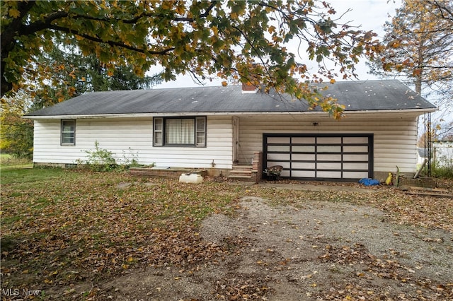 ranch-style home featuring a garage