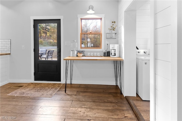 foyer featuring washer / dryer and dark hardwood / wood-style flooring