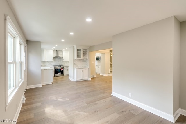 unfurnished living room with light wood-type flooring