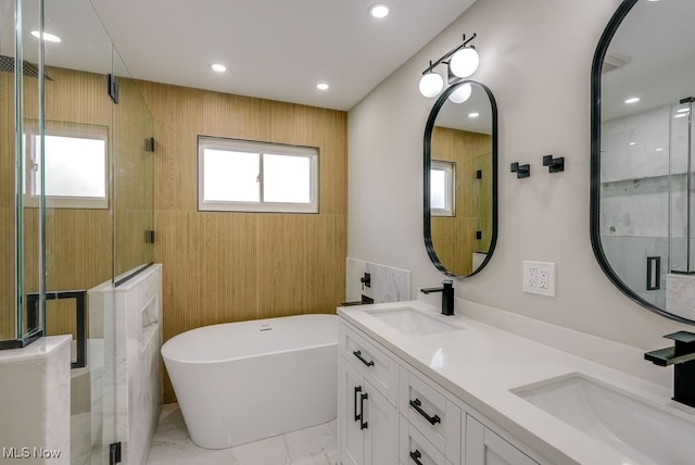 bathroom featuring vanity and shower with separate bathtub