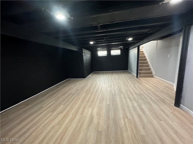 basement featuring light hardwood / wood-style floors