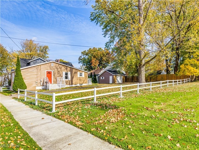 single story home featuring a front yard