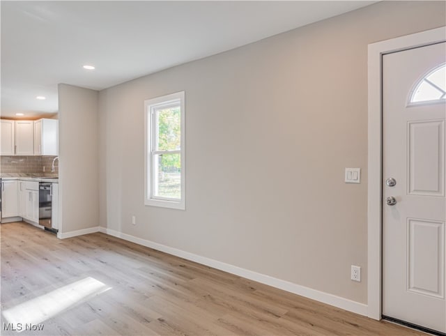 interior space featuring light hardwood / wood-style flooring and plenty of natural light