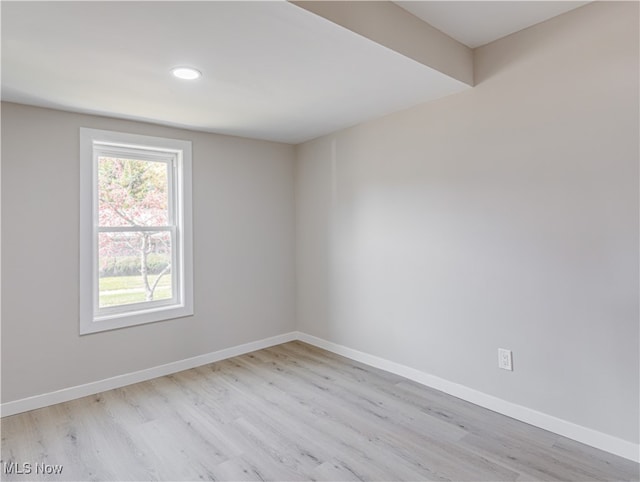 spare room featuring light hardwood / wood-style floors