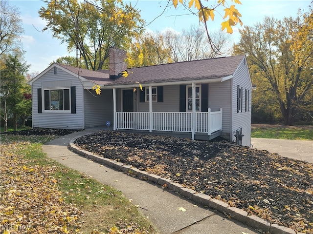 ranch-style home featuring a porch