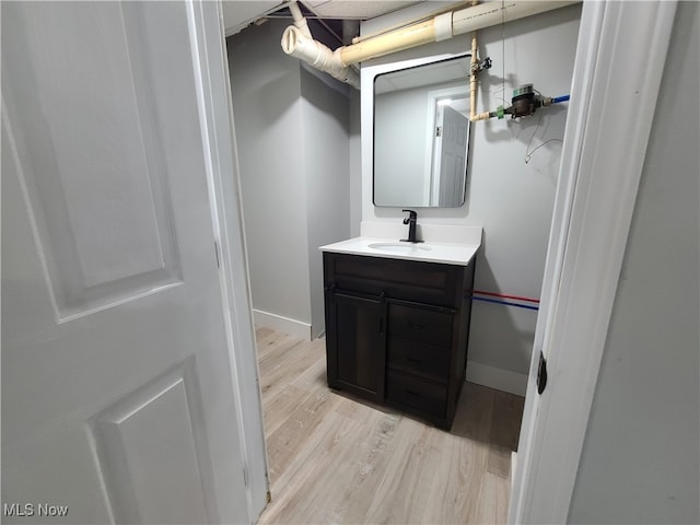 bathroom featuring vanity and hardwood / wood-style flooring