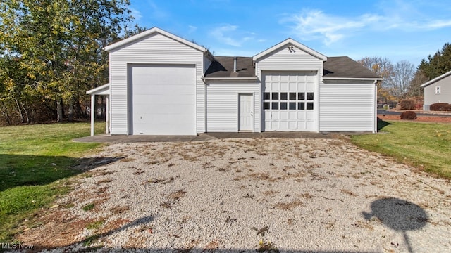 garage featuring a yard