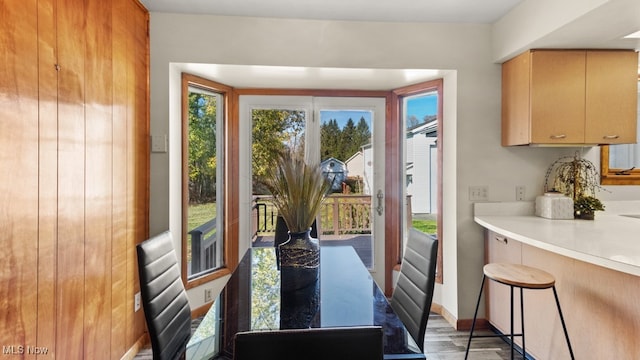 dining space featuring wood-type flooring