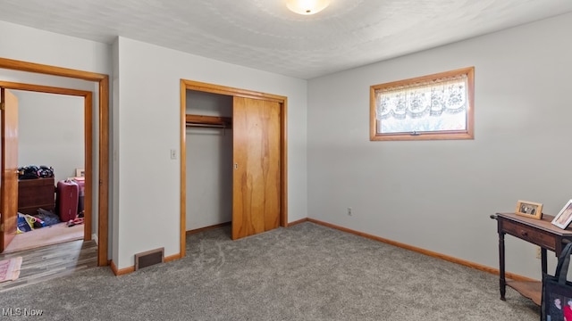 carpeted bedroom featuring a closet