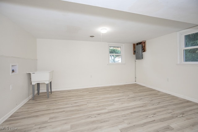 basement featuring light wood-type flooring