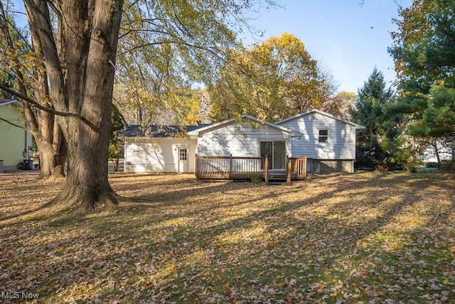 back of property featuring a deck